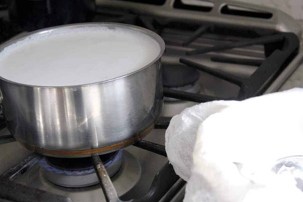 Boiling milk to make homemade Paneer