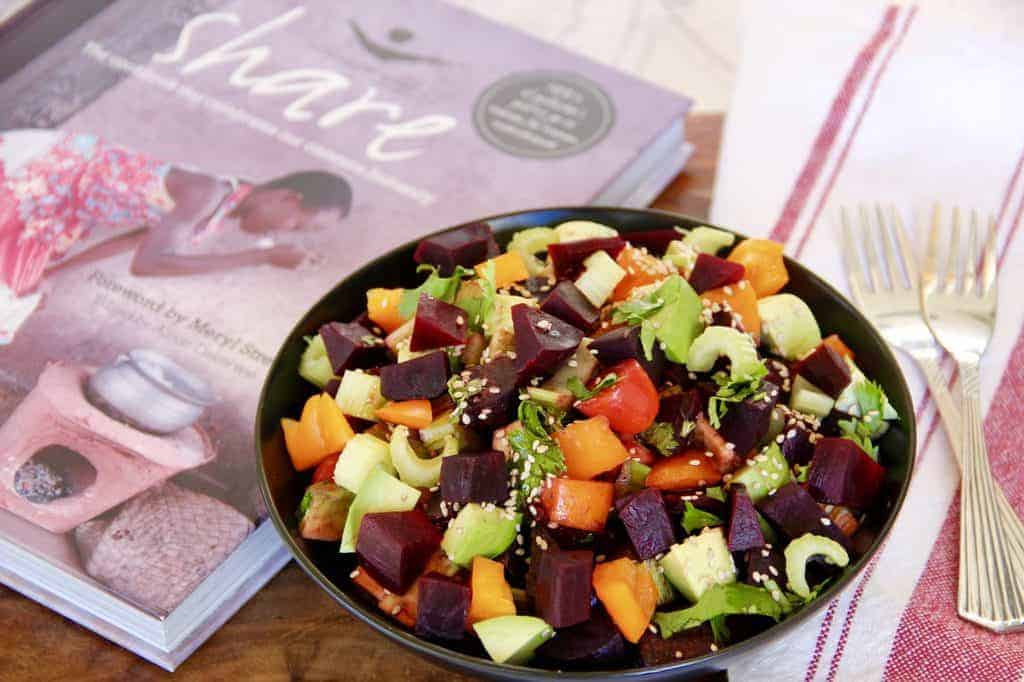 Beet Salad - Roasted beet salad with celery, avocado, bell pepper, grape tomatoes in a ginger, balsamic vinegar dressed garnished with toasted sesame seeds.