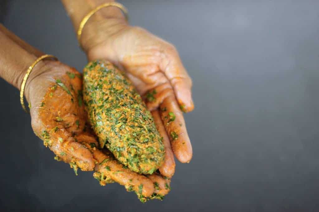 kothimbir vadi dough held in mother-in-law hands