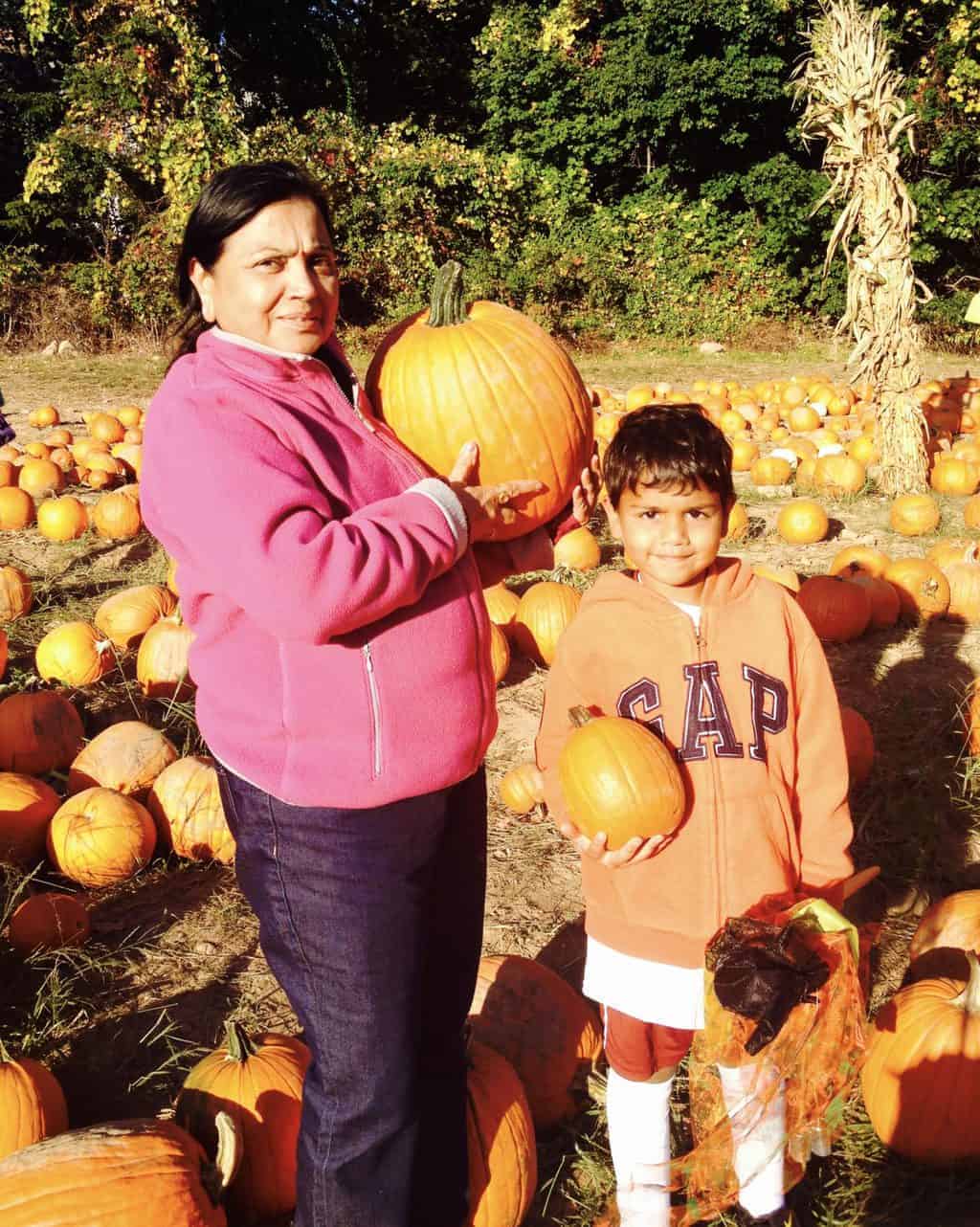 photo of Arav with mom at a pumpkin patch 