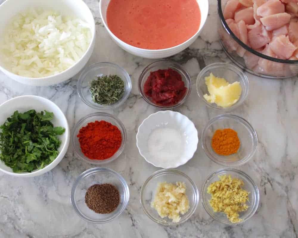 Instant Pot butter chicken ingredients in bowls 