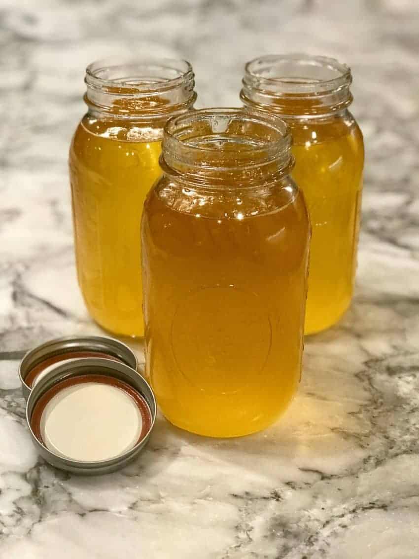 three Mason jars filled with ghee