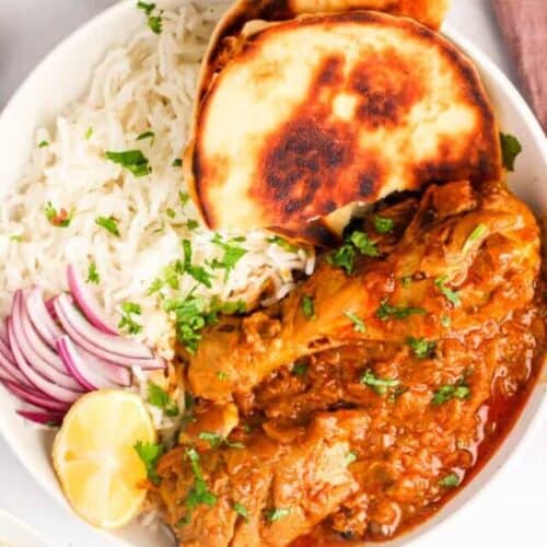 chicken korma served with rice and naan