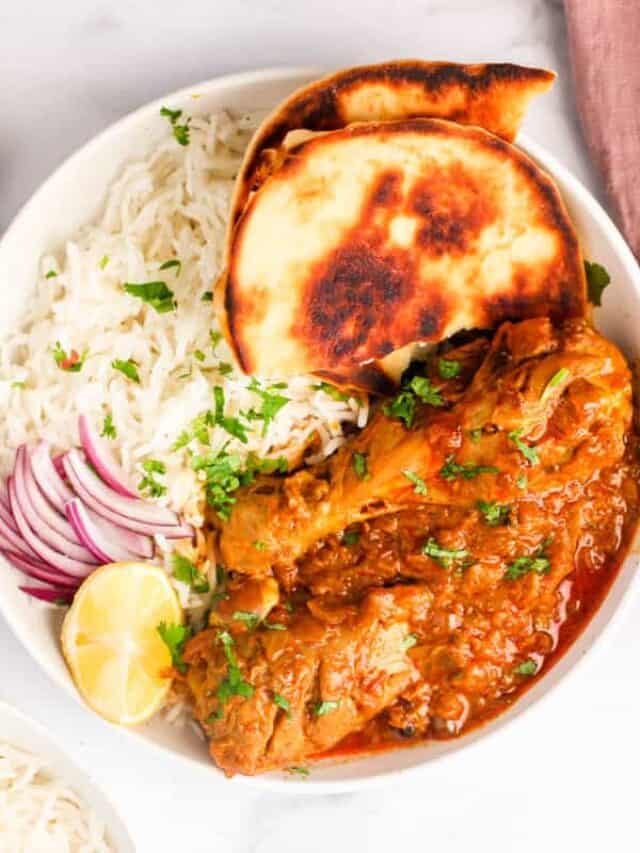 chicken korma served with rice and naan