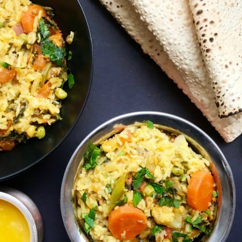 Mixed lentils khichdi served with papad