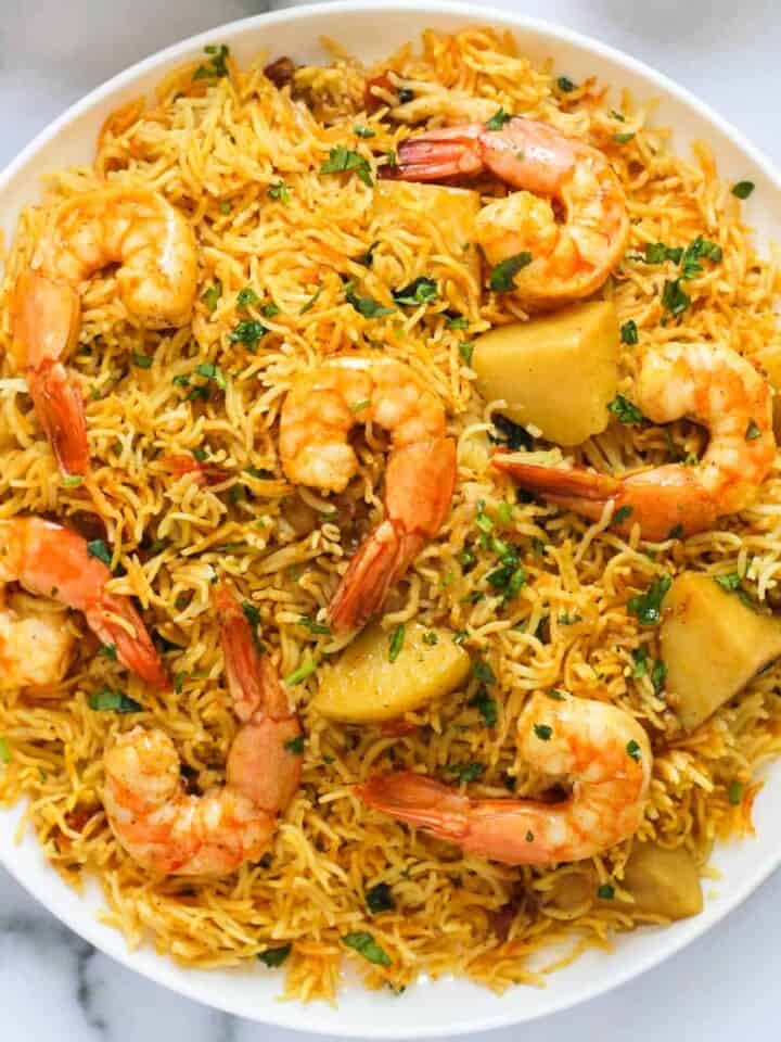Shrimp Biryani with potatoes served in a large platter.
