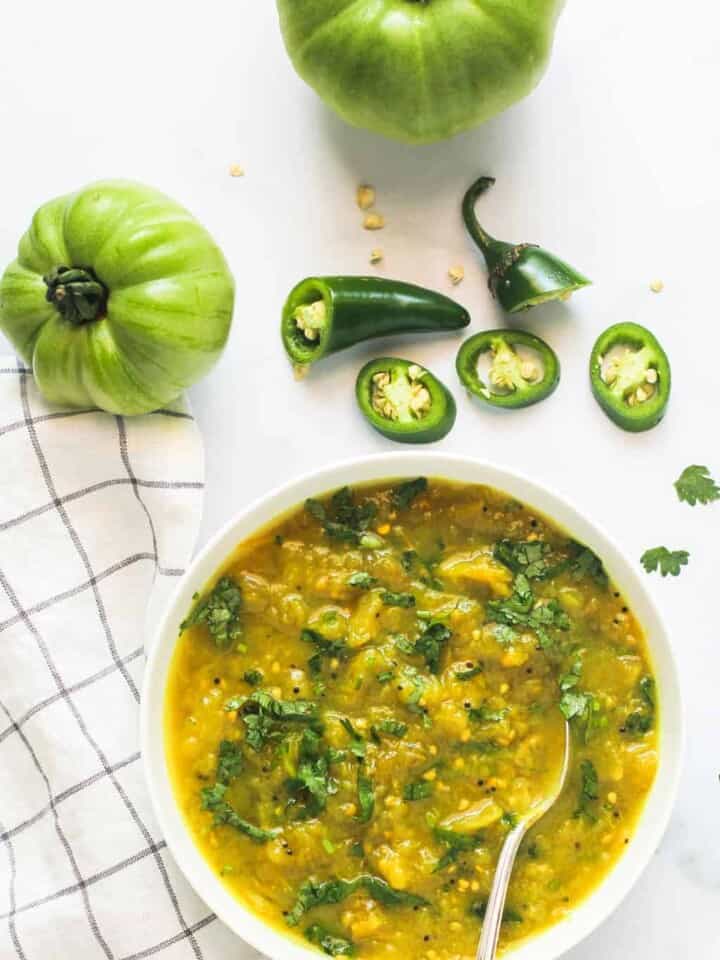 green tomato chutney in a white bowl