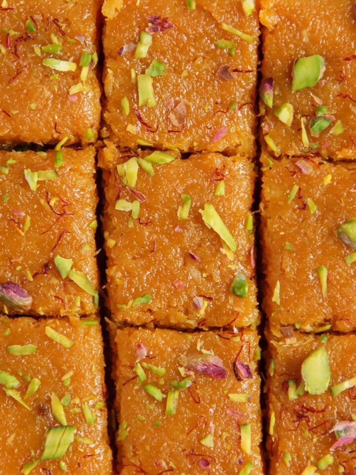 mango burfi garnished with pistachios and saffron
