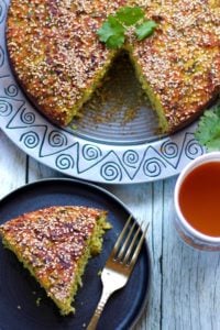 Piece of handvo in a plate with tea