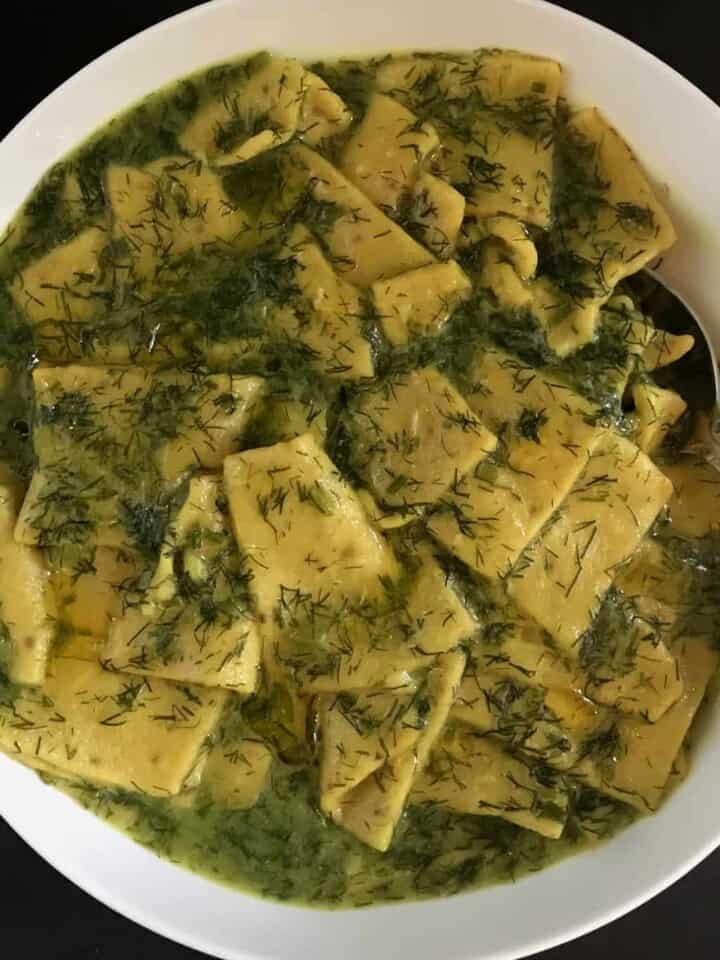 Dill Dhokli served in a white bowl