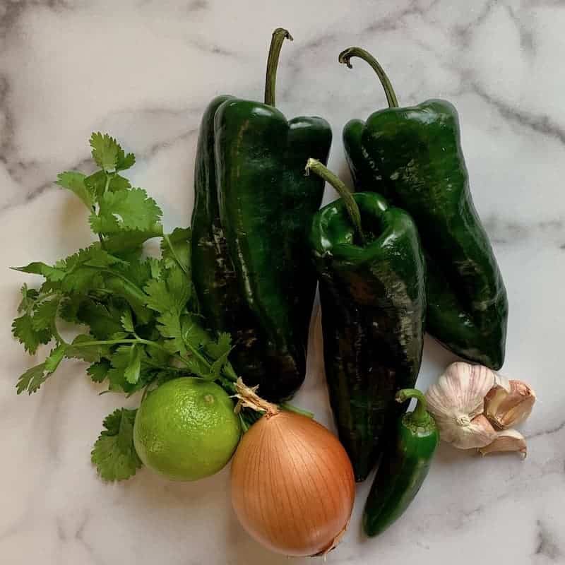 vegetables for chili on marble cutting board