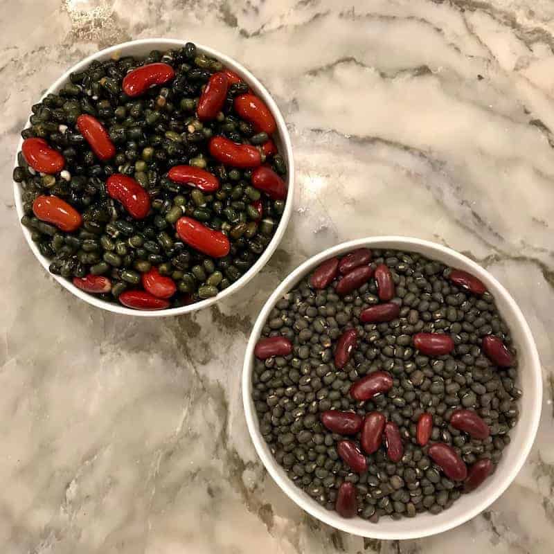 dry and soaked beans in bowls 