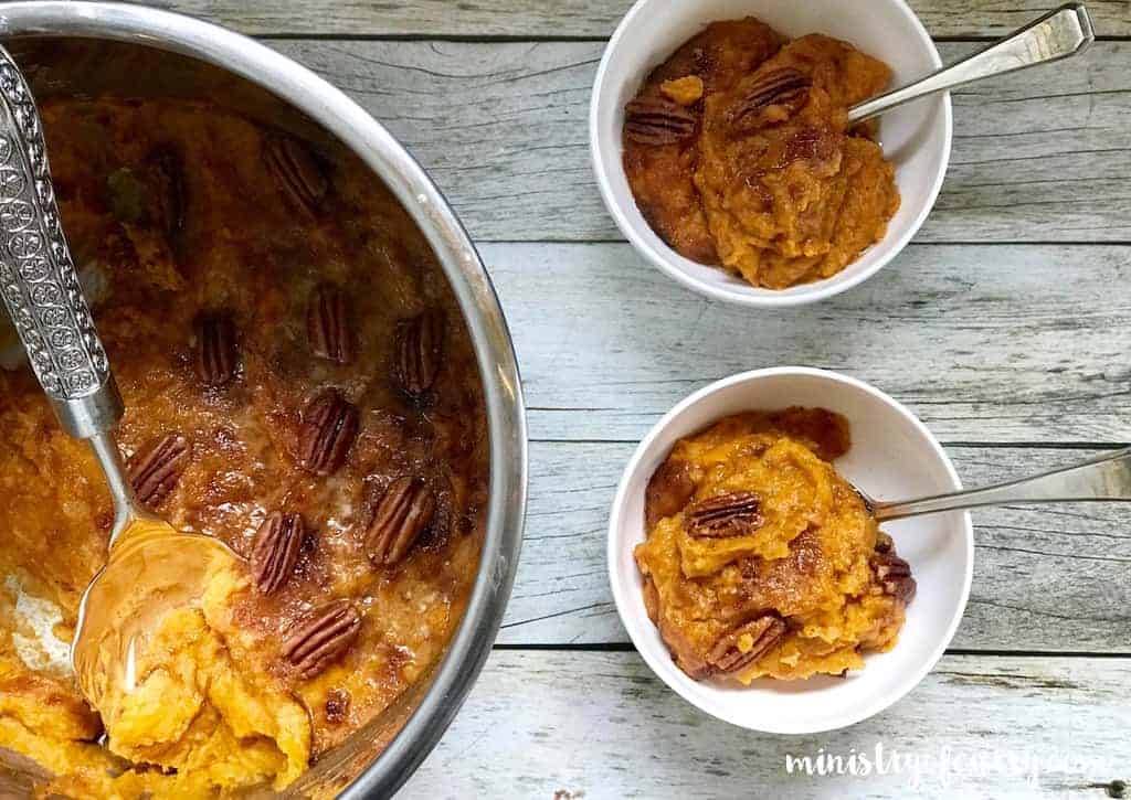 sweet potato casserole in Instant Pot and two small white bowls