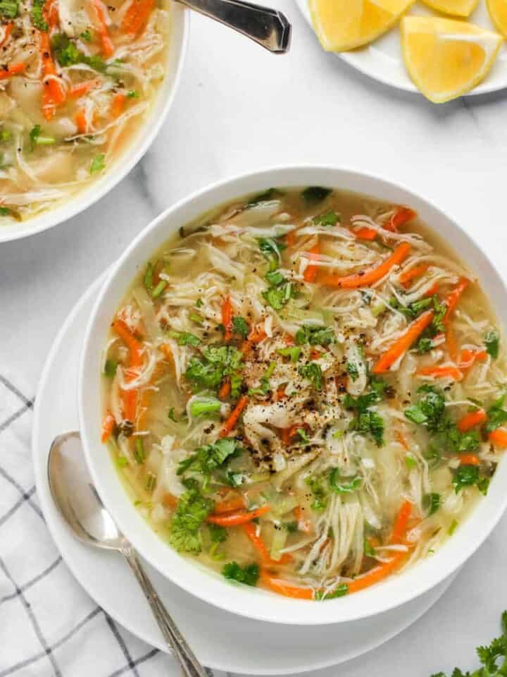 chicken cilantro soup served in a white bowl