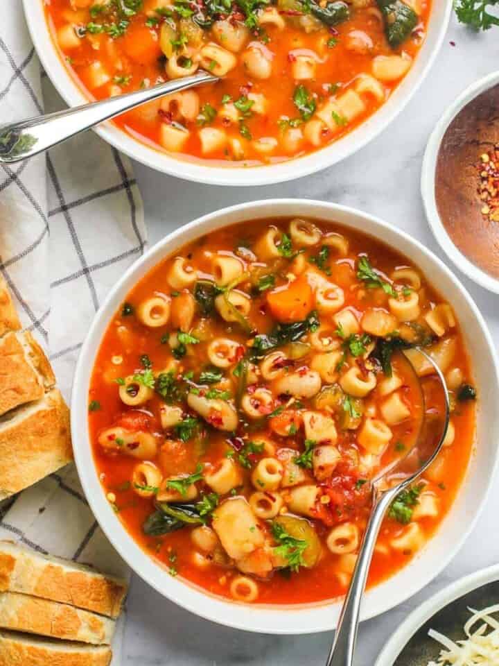 pasta fagioli soup served with sliced baguette