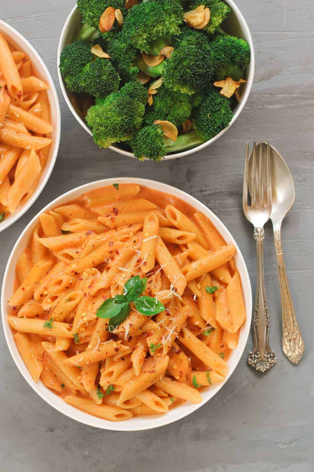 Pasta with Creamy Tomato Sauce served with broccoli 