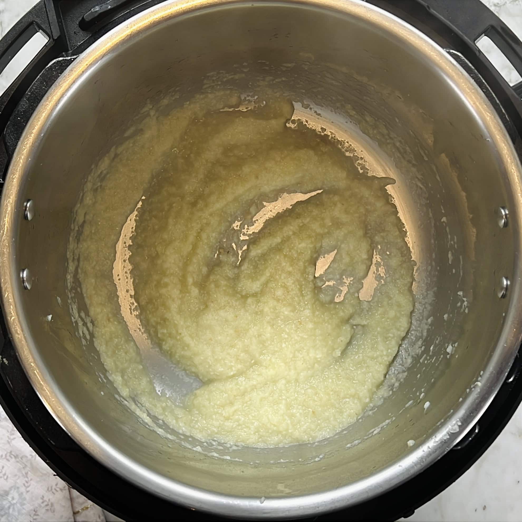 sauteeing onion, ginger, garlic paste in the Instant Pot.
