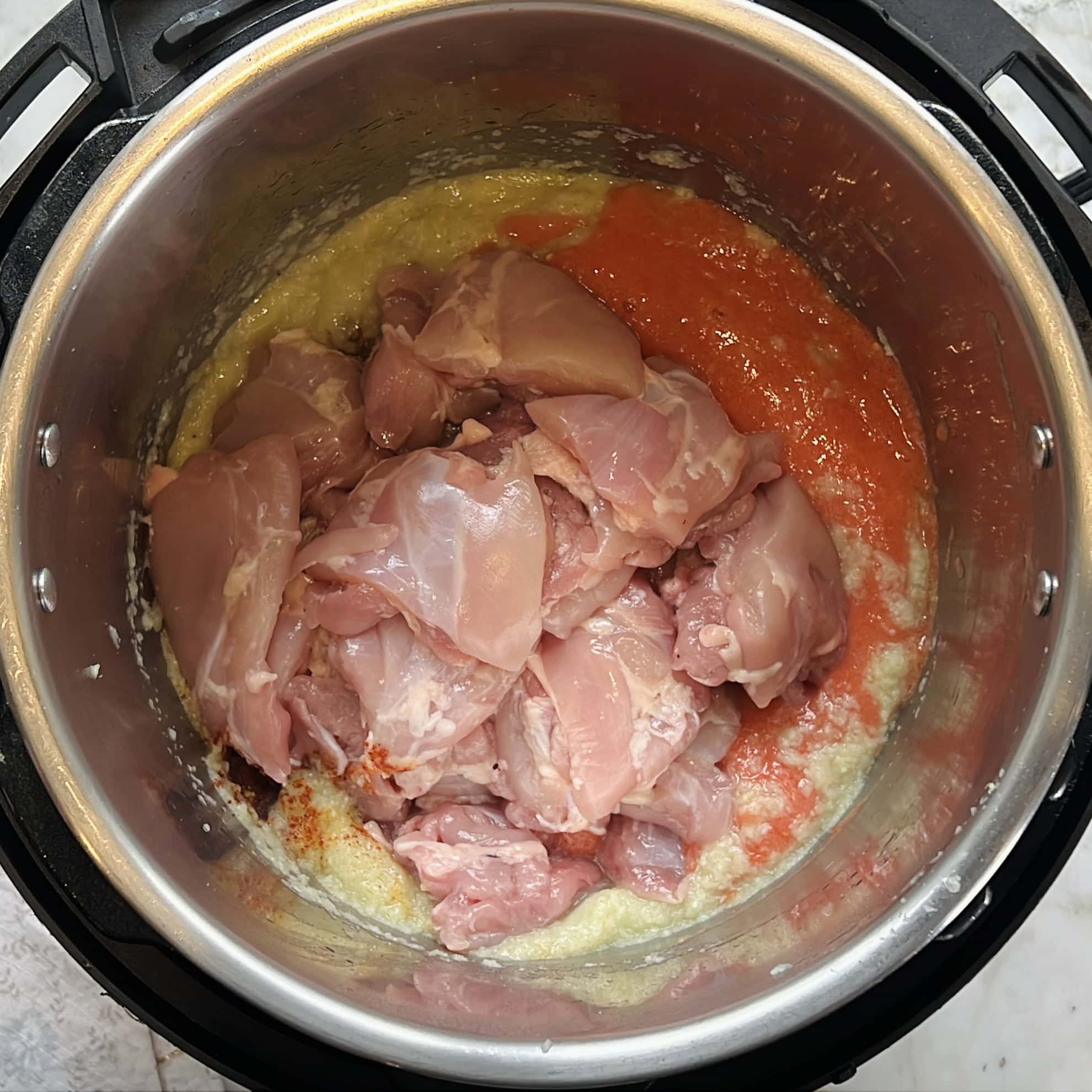 chicken added to the Instant Pot.