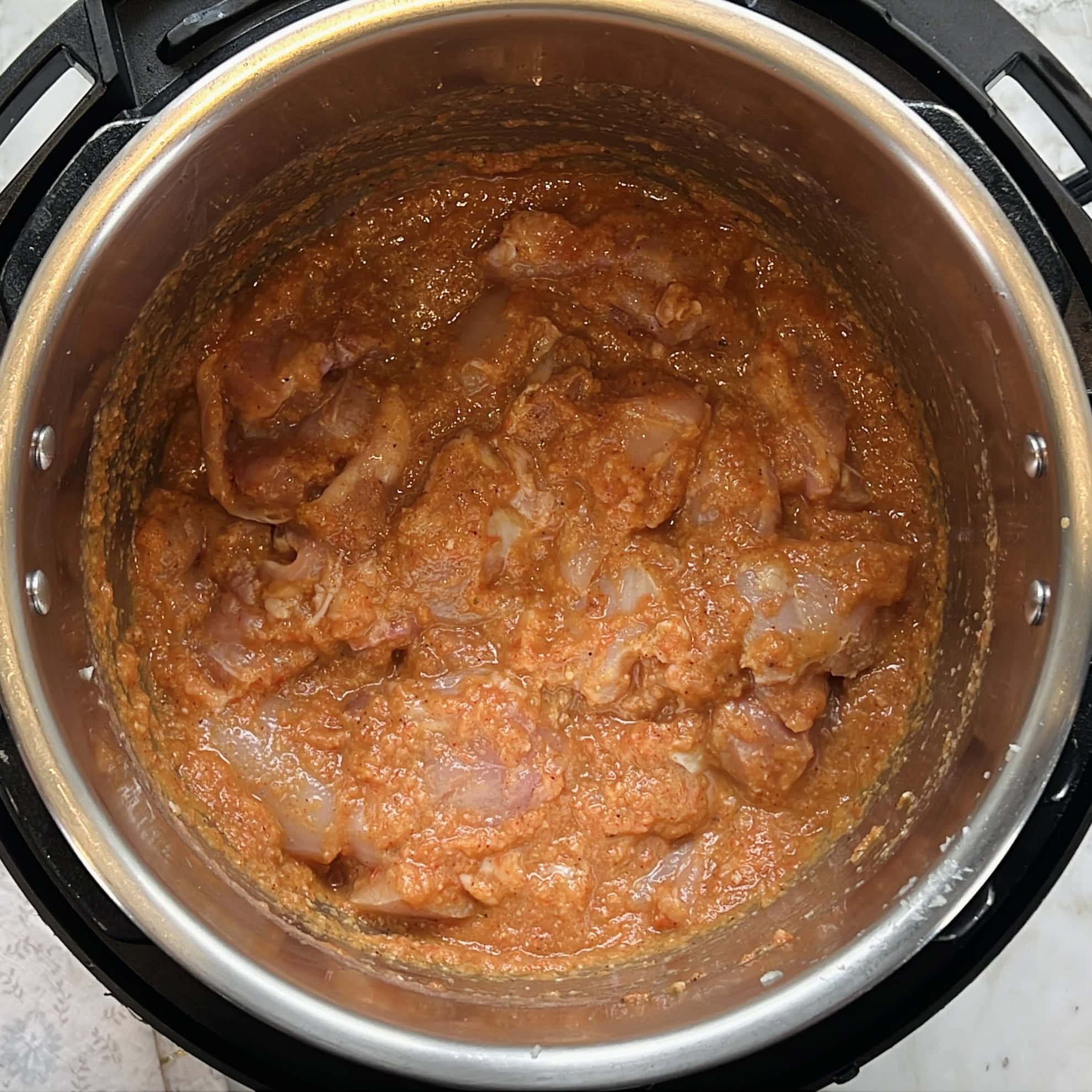 chicken curry ready to be cooked in the Instant Pot.