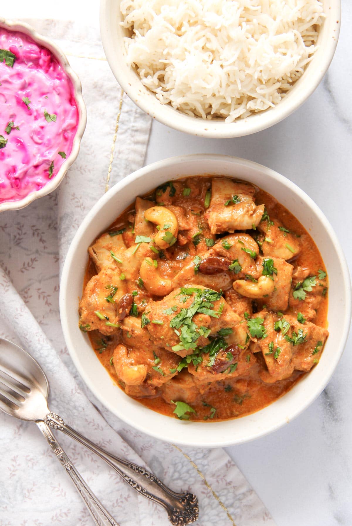 Shahi chicken korma served with rice and beet raita.