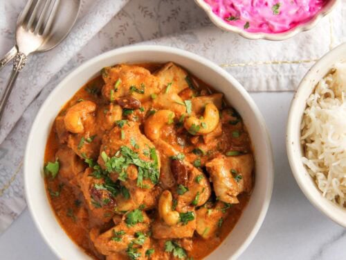 shahi chicken korma served with rice and raita.