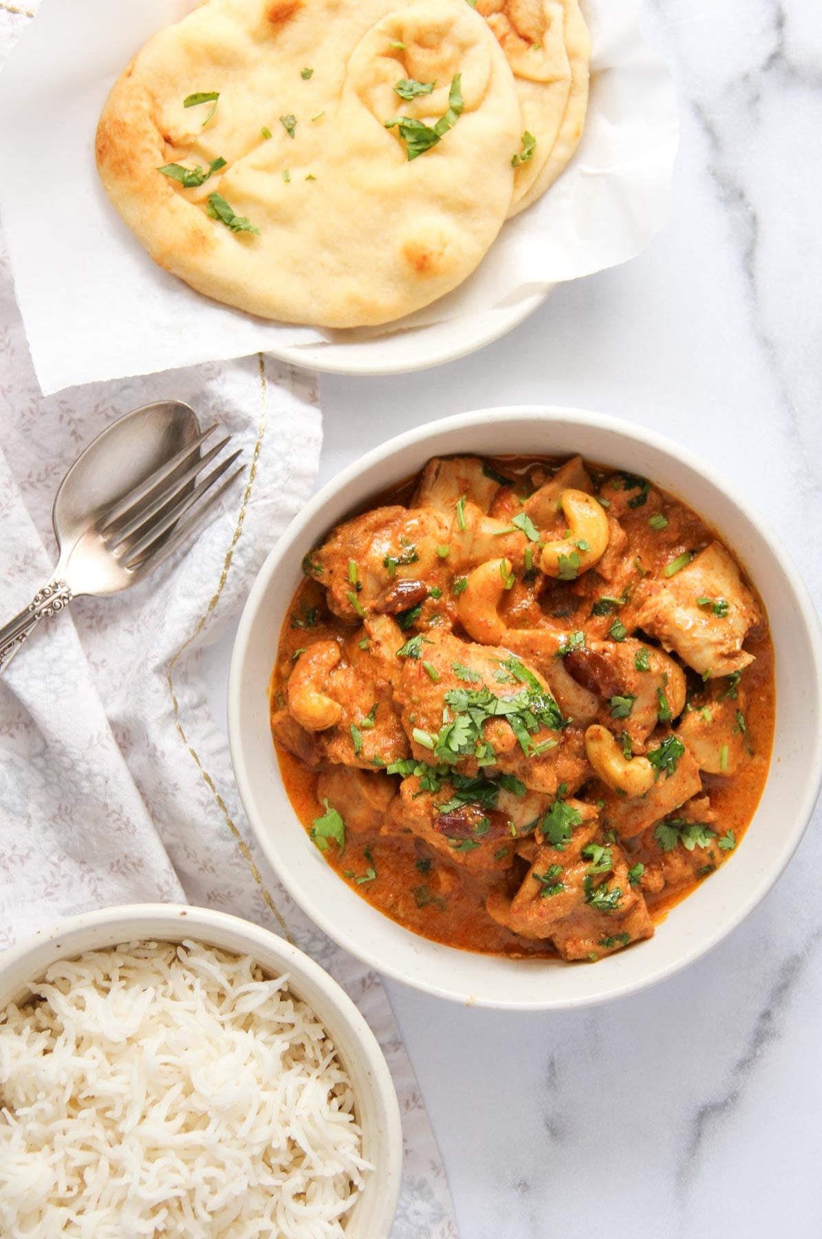 shahi chicken korma served with basmati rice and naan.
