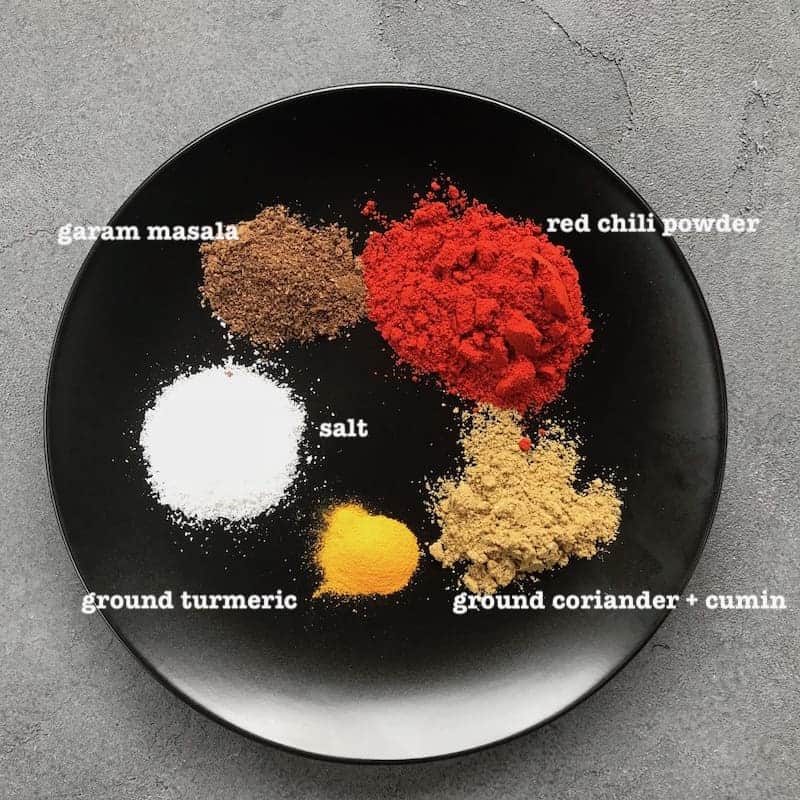 black plate with spices on it