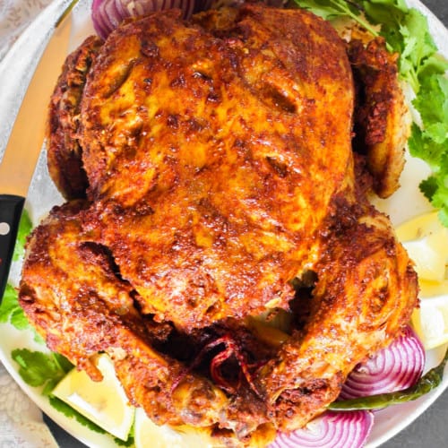 Whole Tandoori Chicken in a platter