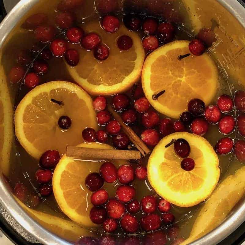 Spiced apple cider ingredients simmering in the Instant Pot