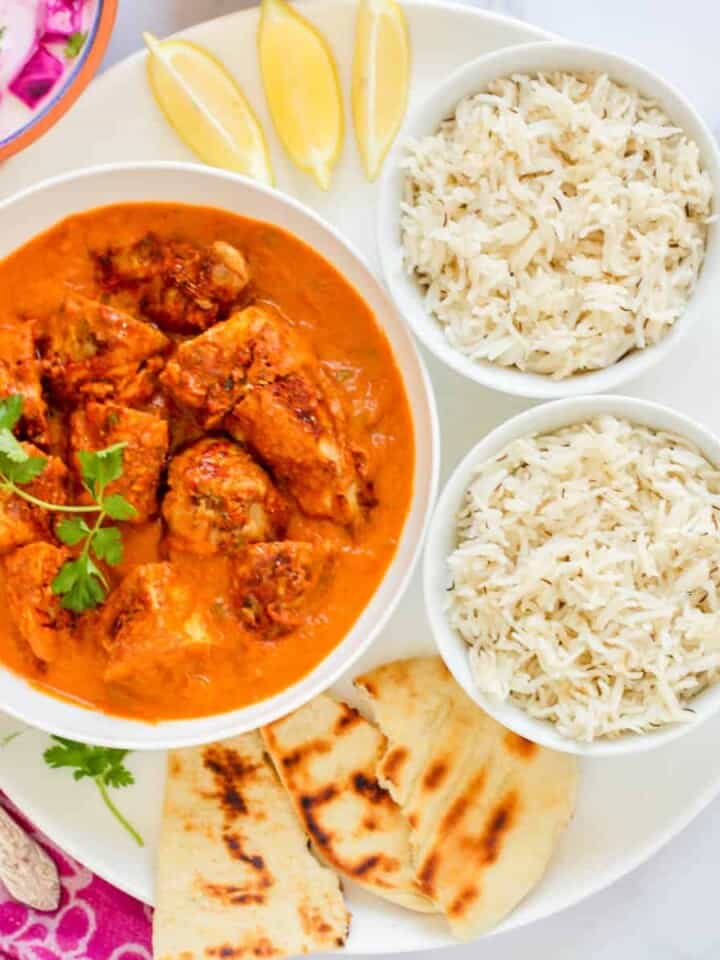 chicken tikka masala served with rice and naan