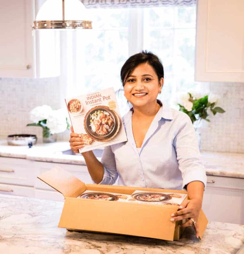 Archana Mundhe with her cookbook