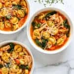 3 white bowls with chicken tortellini soup