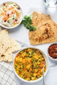 Veg Kurma served with parathas, rice and papad