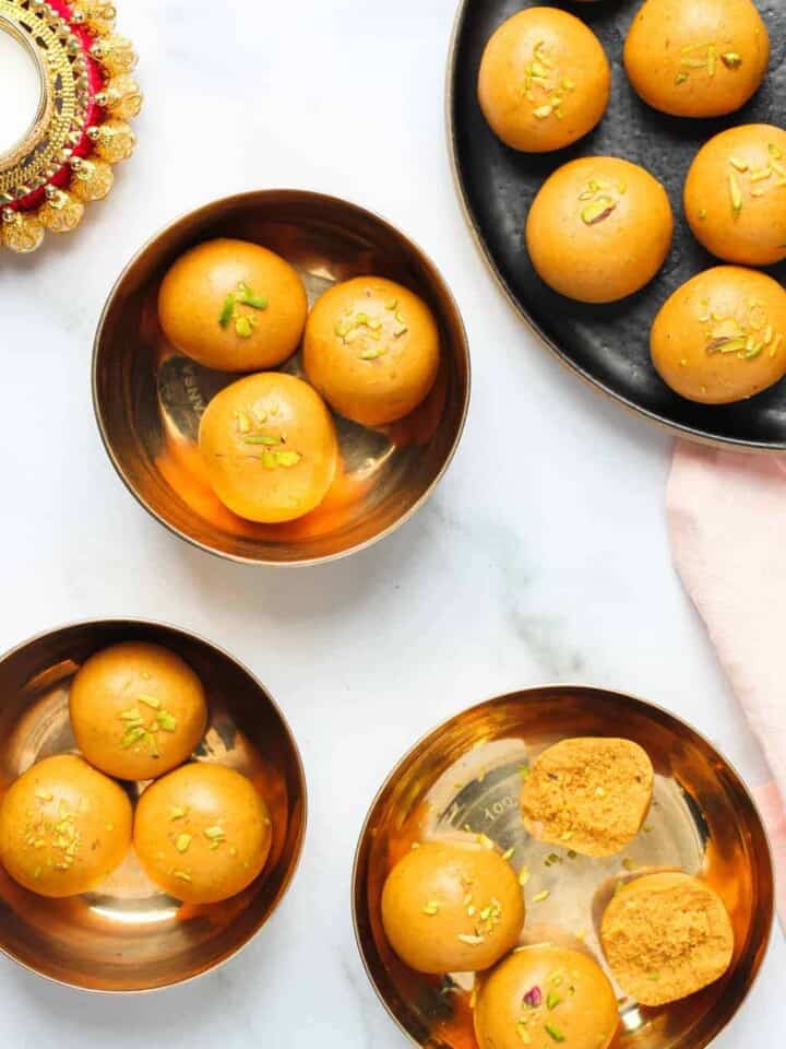 Besan laddu served in small brass plates