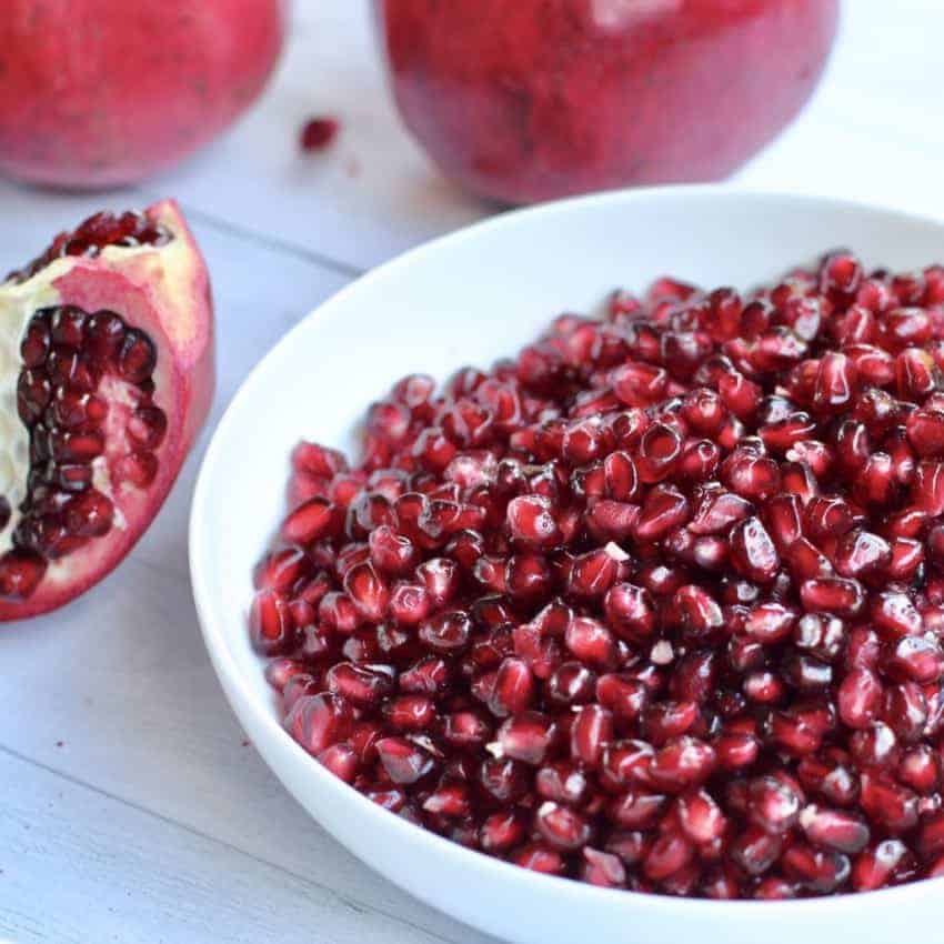 peeled pomegranate seeds in a white bole 