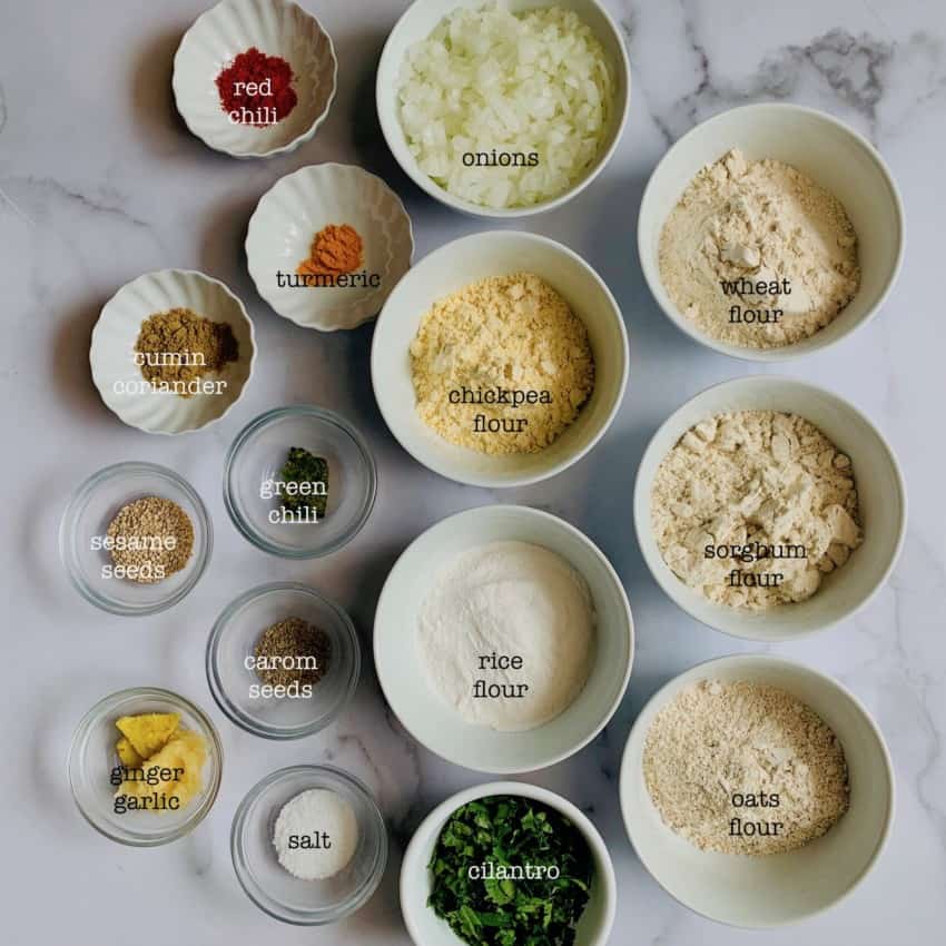 Thalipeeth Ingredients in individual bowls 
