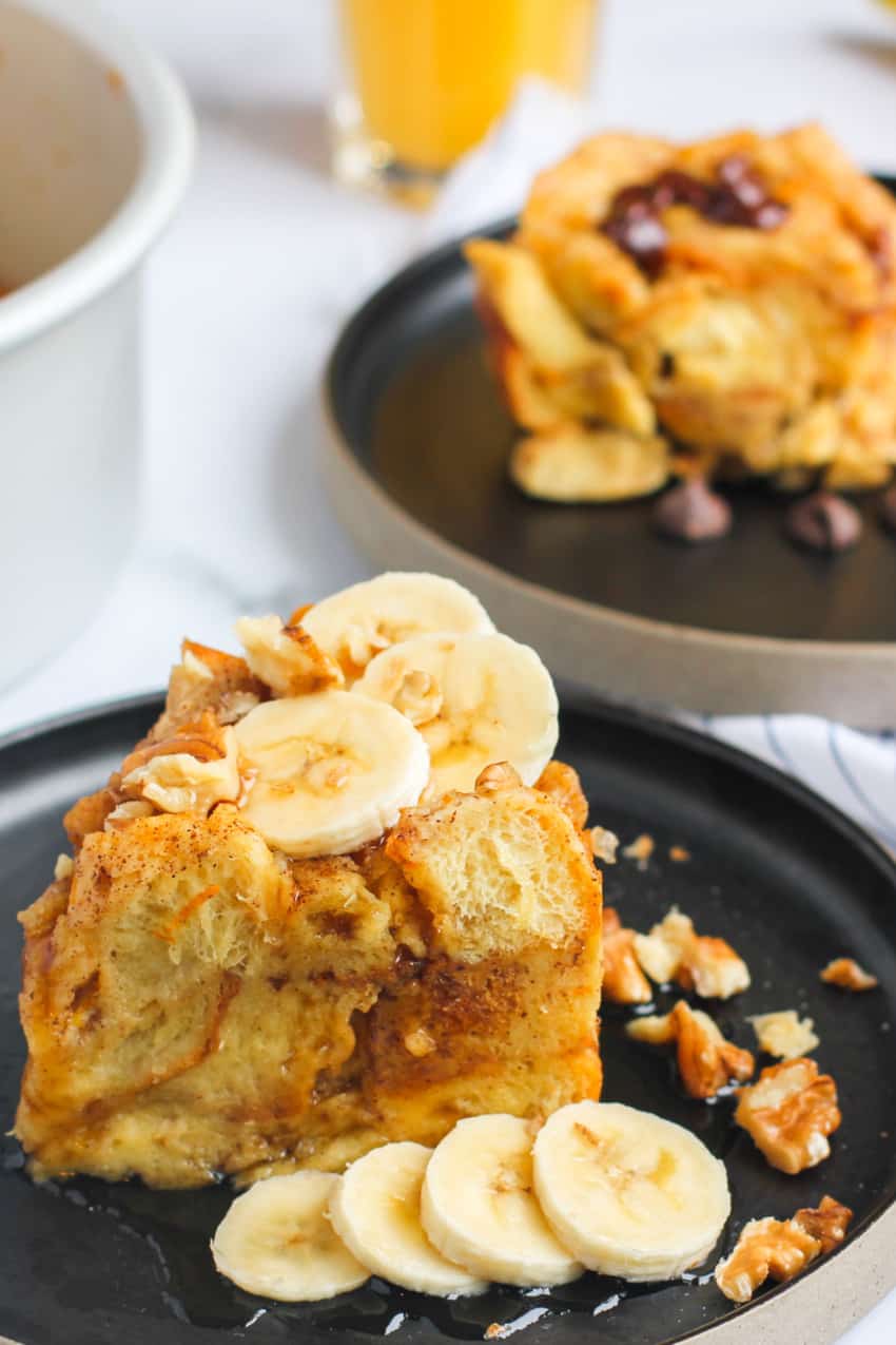 Bread Pudding topped with maple syrup and bananas 