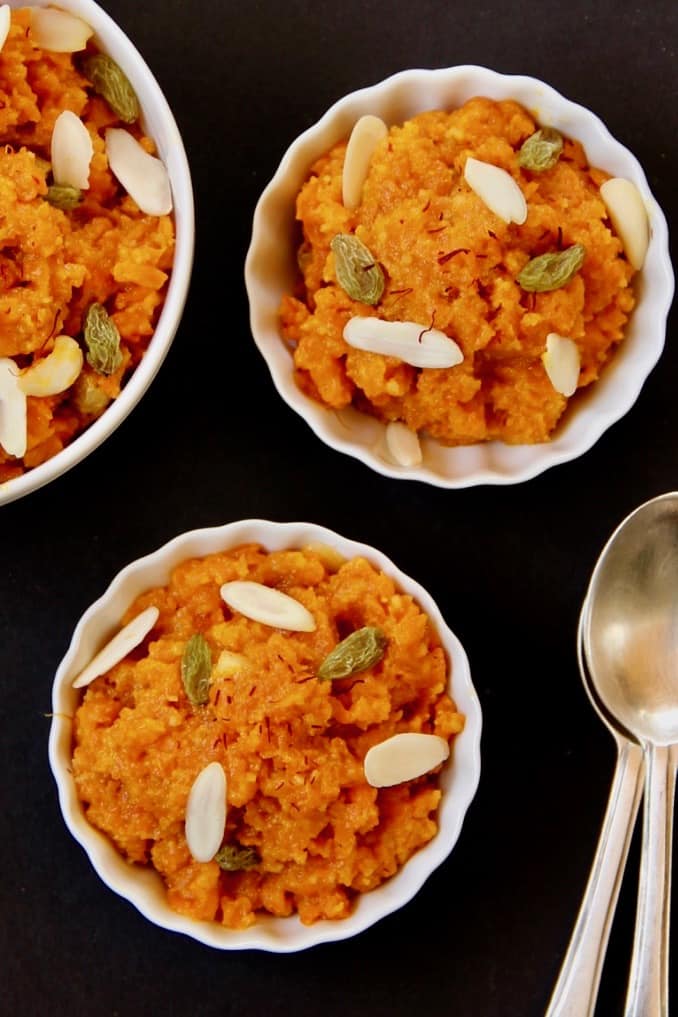 carrot halwa in 3 white bowls