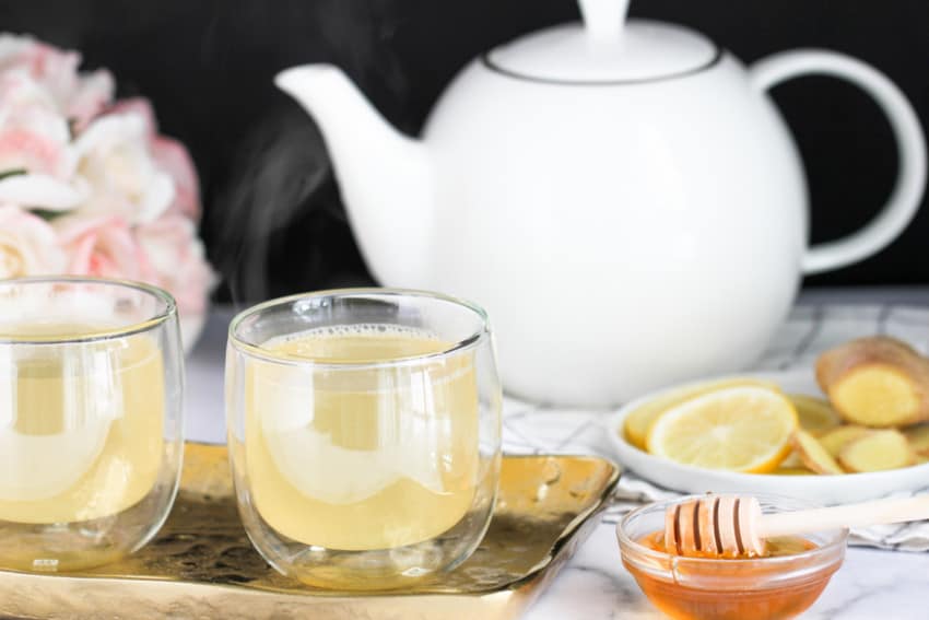 lemon ginger tea in cups with a teapot 