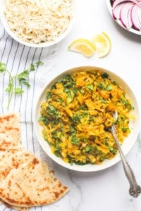 Cabbage stir fry served with naan and rice