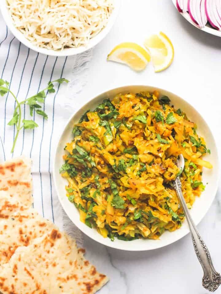 Cabbage stir fry served with naan and rice