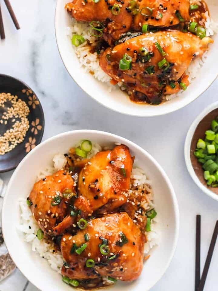 Chicken Teriyaki served in 2 white bowls with rice
