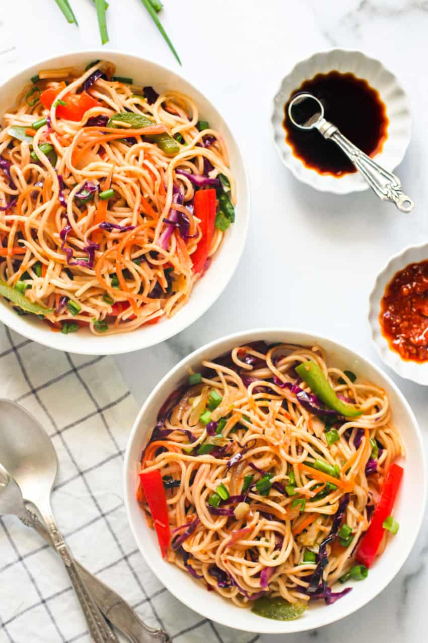 Veg Hakka noodles in 2 white bowls