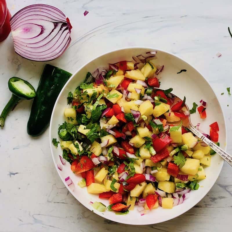 pineapple salsa in a white bowl 