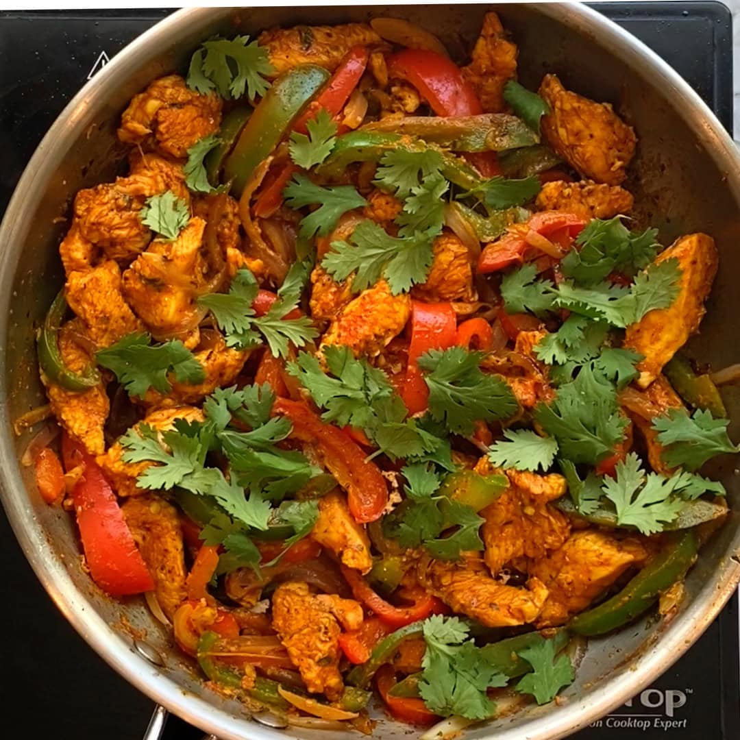 chicken kathi rolls filling garnished with cilantro.