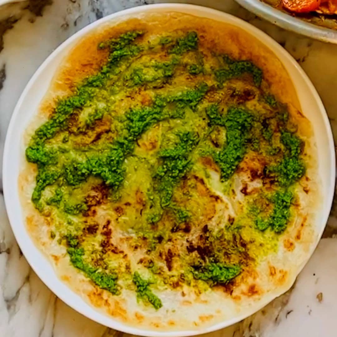 green chutney smeared on a paratha.