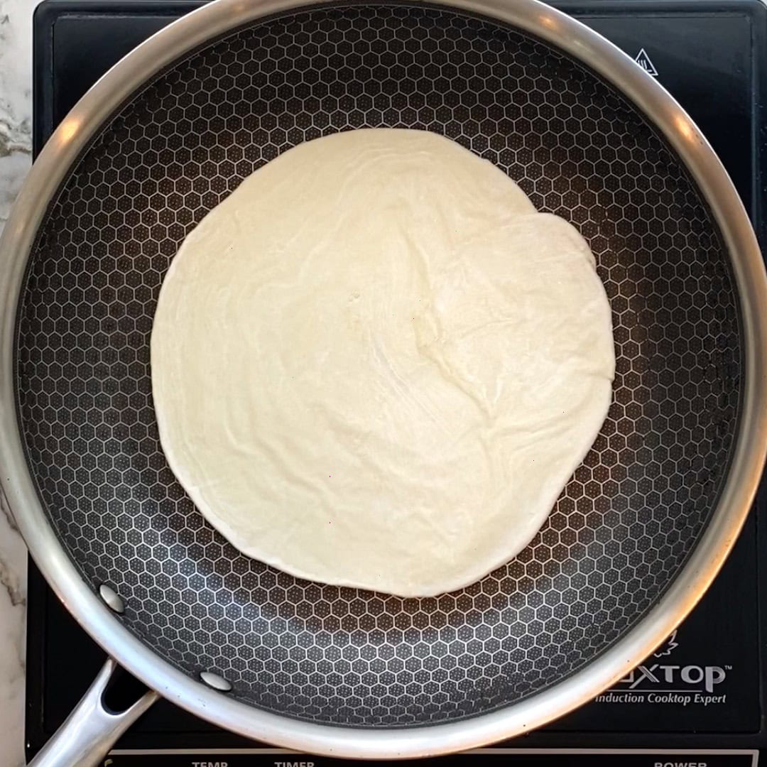 frozen kawan paratha in a pan.