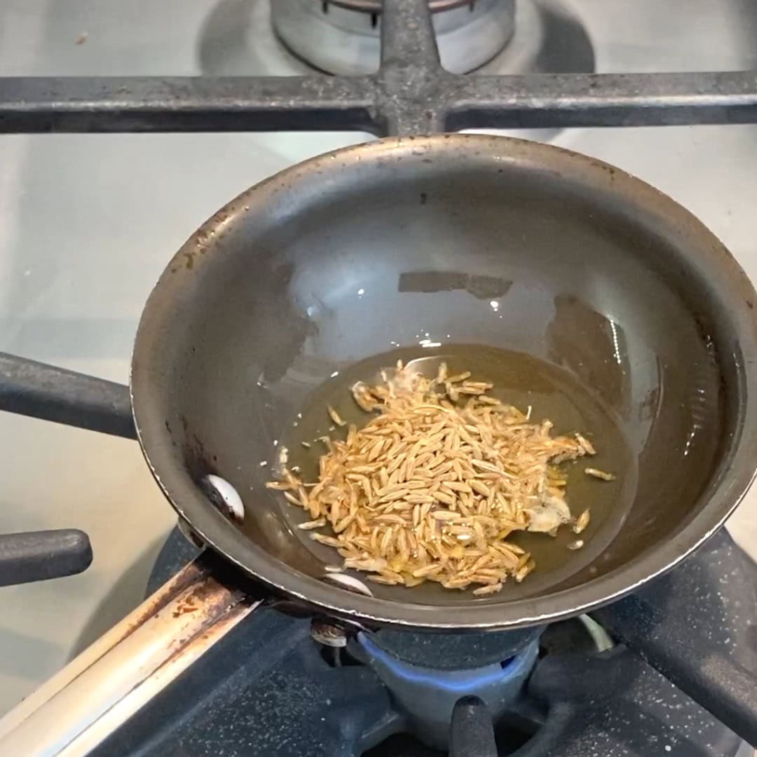 cumin seeds in hot ghee.