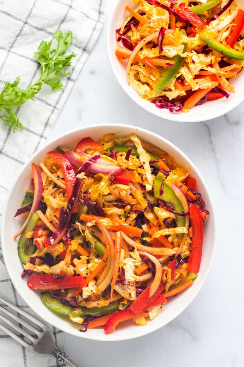 Cabbage salad in 2 white bowls 