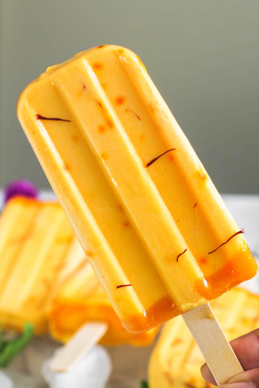 close up of one popsicle with saffron on it